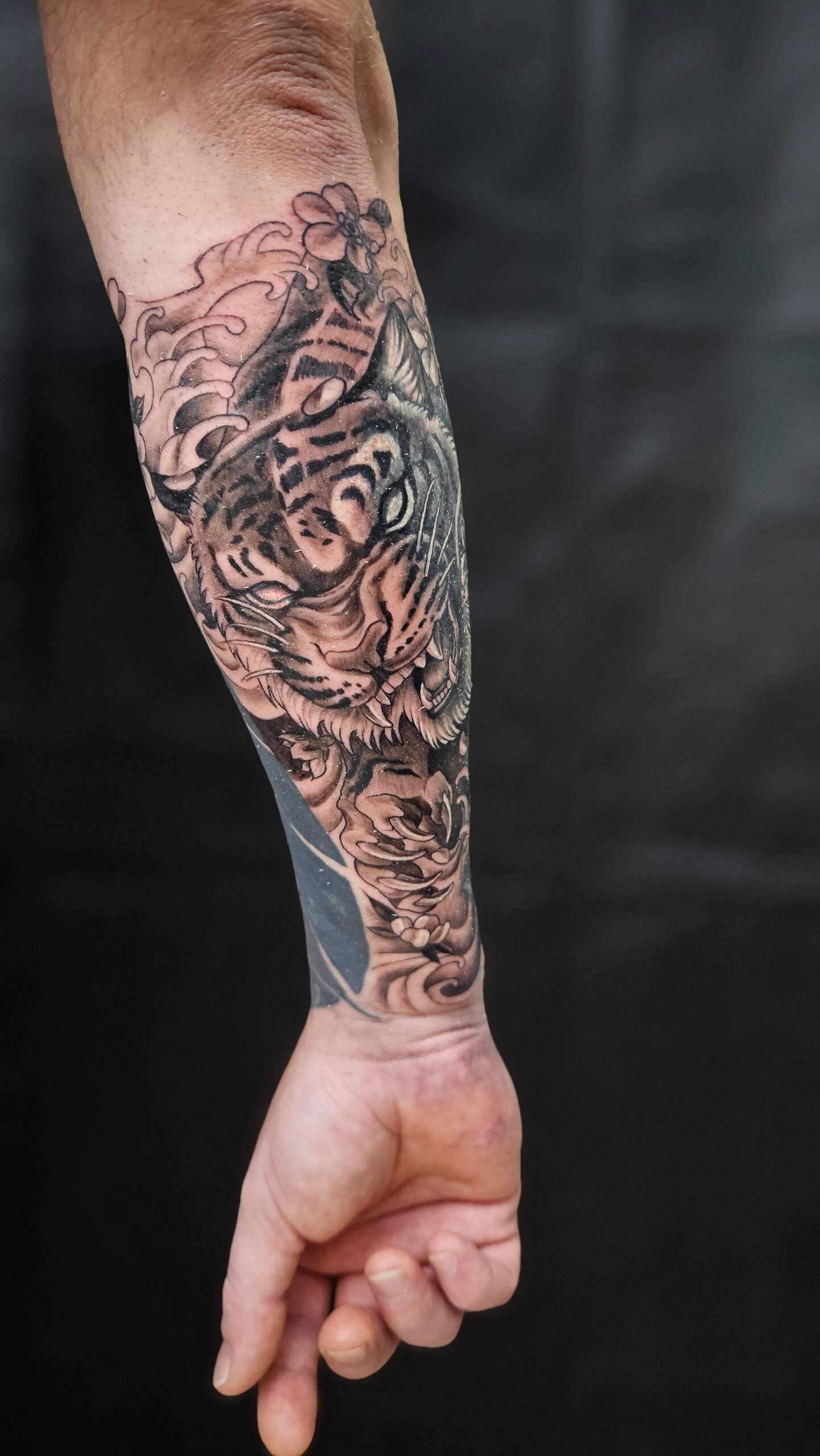 Tiger, animated, Japanese style, black and gray, arm tattoo Lethal Ink Tattoo, Phra Tamnak, Pattaya, 2025