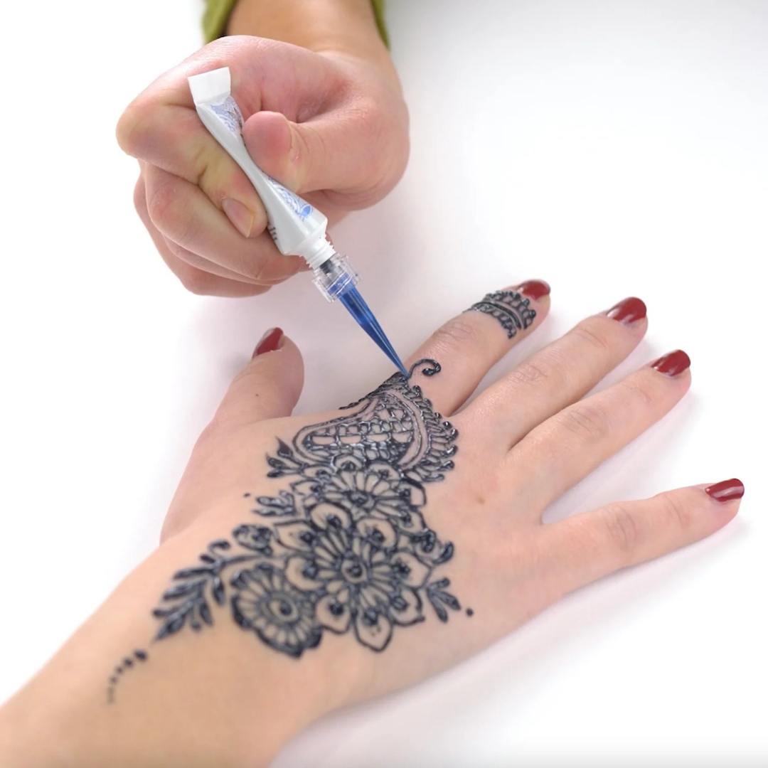 Jagua blue ornamental temporary tattoo application on hand by Lethal Ink Tattoo, Pattaya (2025)