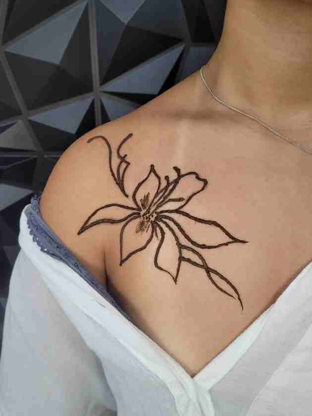 Minimal flower henna tattoo on shoulder at Lethal Ink Tattoo Pattaya (2026)