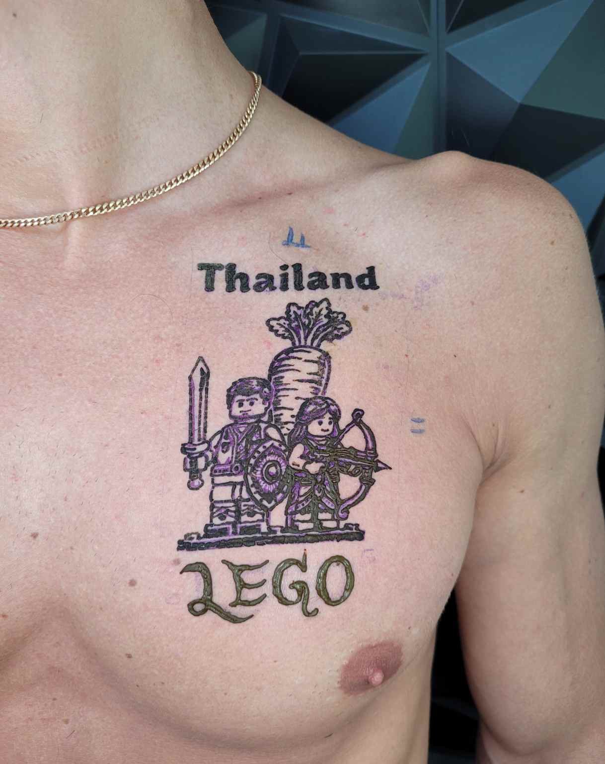 LEGO Thailand cartoon chest tattoo in jagua ink at Lethal Ink Tattoo Pattaya (2026)