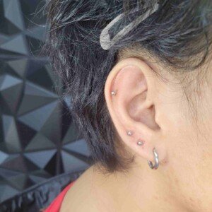 Ear lobe three ring piercing with surgical steel studs at Lethal Ink Tattoo Pattaya. Ear lobe three ring piercing surgical steel studs at Lethal Ink Tattoo Pattaya (2026)