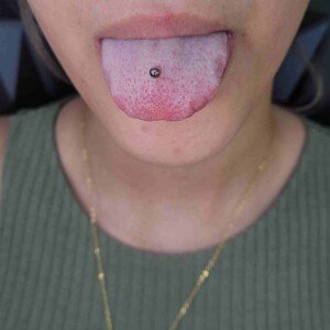 Tongue piercing with surgical steel barbell at Lethal Ink Tattoo Pattaya. Tongue single ring piercing with surgical steel barbell at Lethal Ink Tattoo Pattaya (2026)