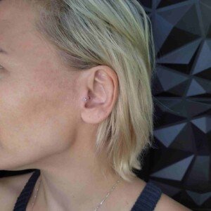 Tragus ear single ring piercing with surgical steel stud at Lethal Ink Tattoo Pattaya. Tragus ear single ring piercing surgical steel stud at Lethal Ink Tattoo Pattaya (2026)